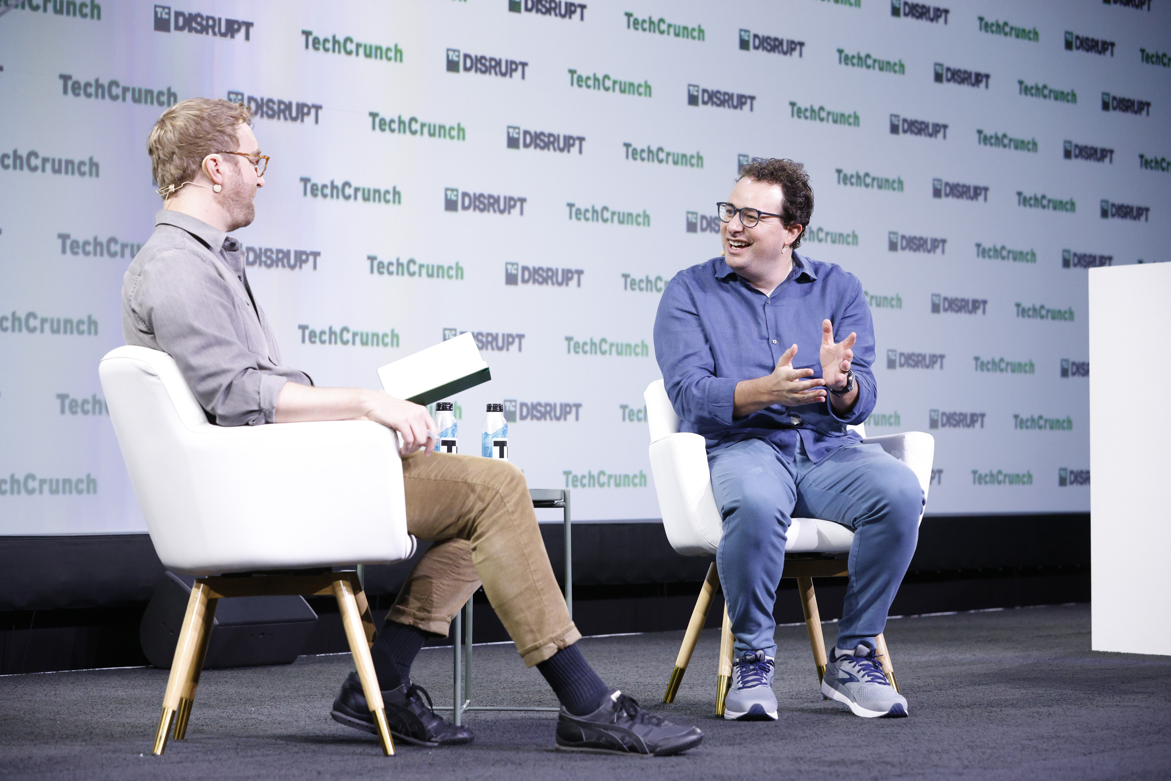 Dario Amodei speaking on stage at TechCrunch Disrupt 2023
