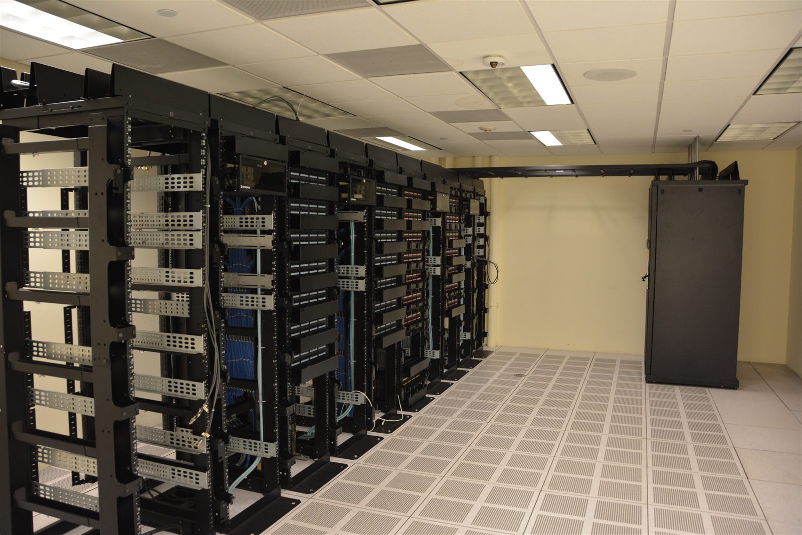 Long rows of server racks in a modern data center, the infrastructure now serving more bots than humans