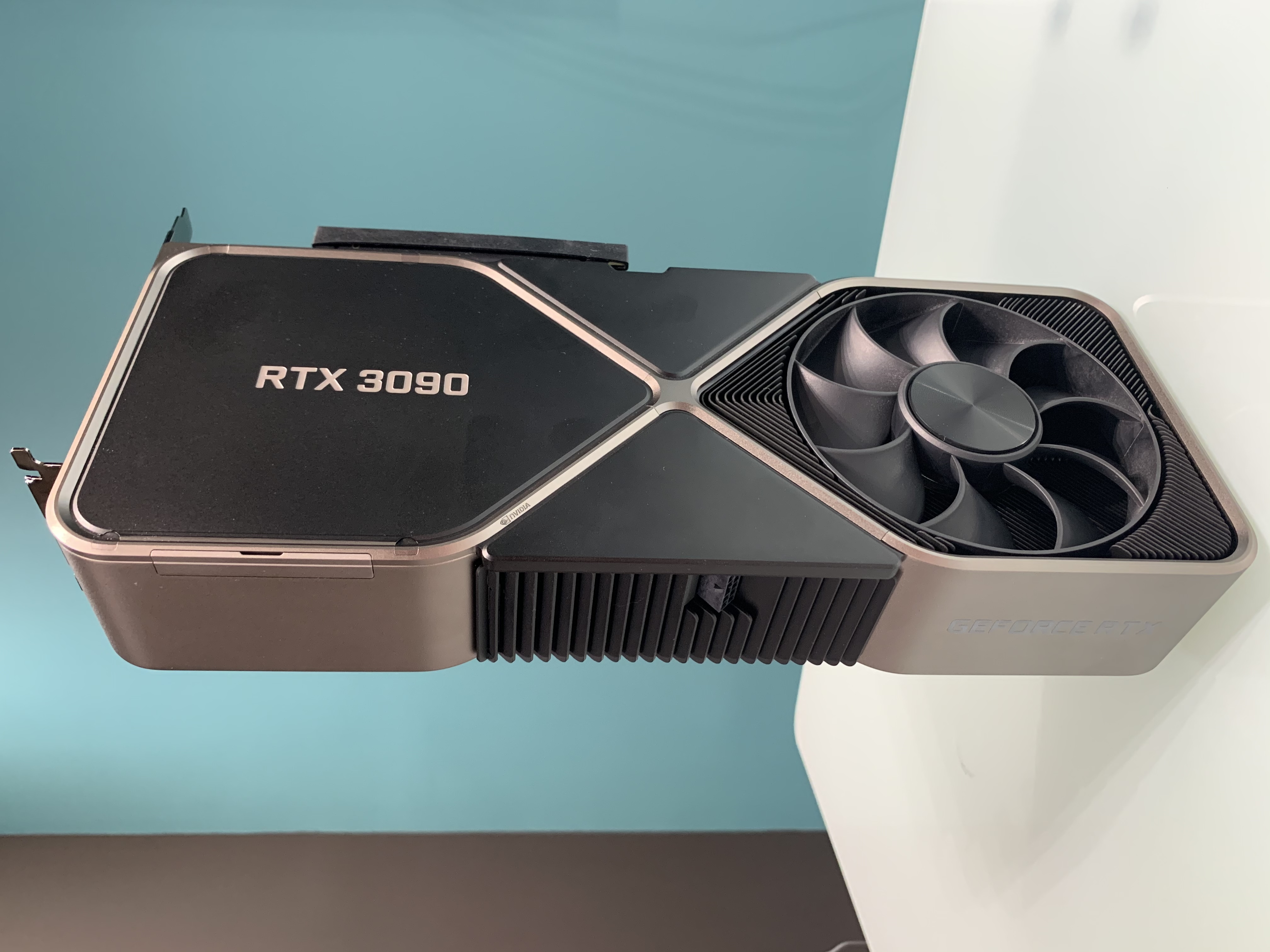 An NVIDIA GeForce RTX 3090 Founders Edition graphics card on a desk